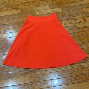 The Limited Petite orange fit and flair skirt.